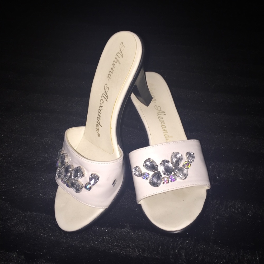 Athena Alexander white slip on sandals.